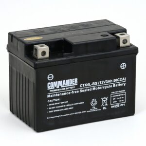 Black Commander maintenance-free motorcycle battery with top terminals and branding visible on side panel